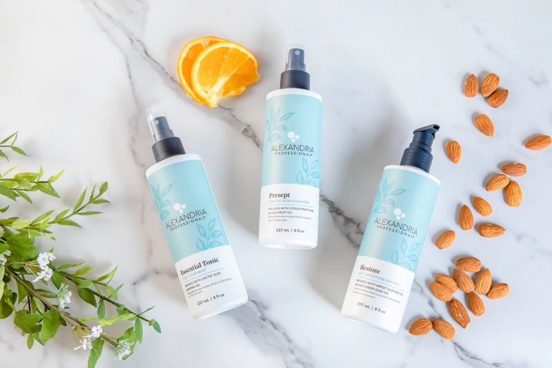 Picture of Alexandria Professional's three products include in the I Love My Skin kit with an orange and almonds. Products are Presept Gentle Skin Cleanser, Essential Tonic 3-in-1 Skin Mist, and Restore 24/7 Moisture Lotion